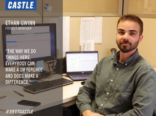 Ethan Gwinn is seated at a computer work station at the Castle Contracting office.