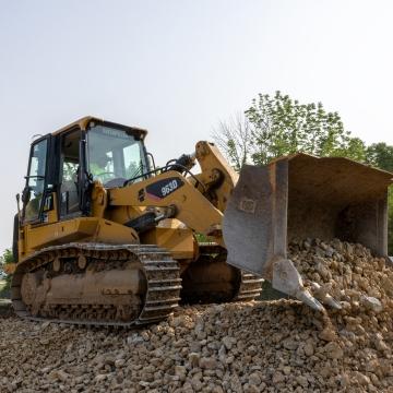 Dozer unloading rock