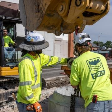 people work on quality construction with machine