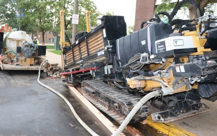 Directional boring along road and walkway