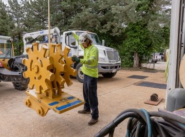 person working on large gear