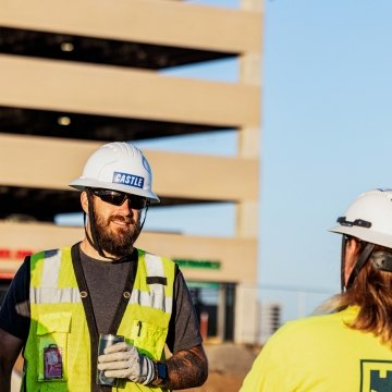 two construction people talking